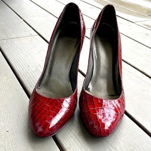 Red patent pumps